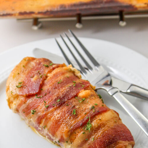 Tender chicken breast is stuffed with cream cheese and cheddar and then wrapped is smoky bacon. Delicious!